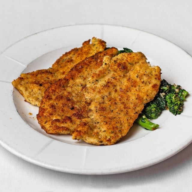 Pan-Fried Chicken Over Broccoli Rabe.